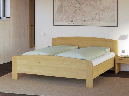 Bett „Kerstin“ aus Eiche Hell in 180 x 200 cm, mit niedrigem runden Fußteil und ohne Gravur